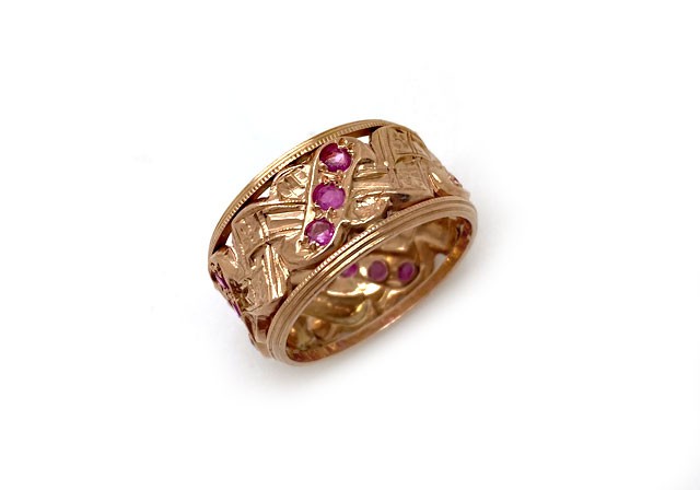Vintage 14k rose gold wide band with rubies in an alternating ribbon design