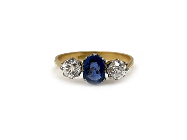 14k yellow gold sapphire and diamond three stone ring.