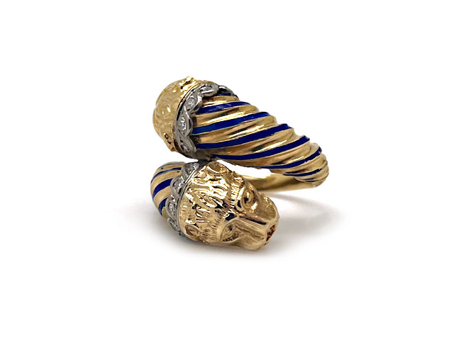 Greek 18k yellow gold bypass design ring with lionheads, blue enamel and diamonds.